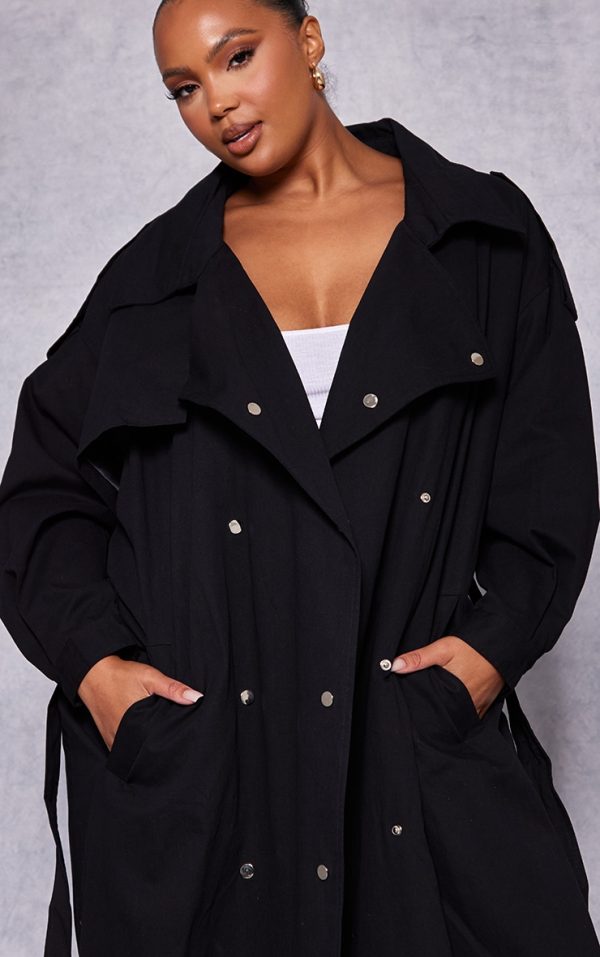 3cc6a8cb342bb5d0c0f6457880af75b048226945_CNF1107_4_plus_black_popper_detail_trench_coat-1