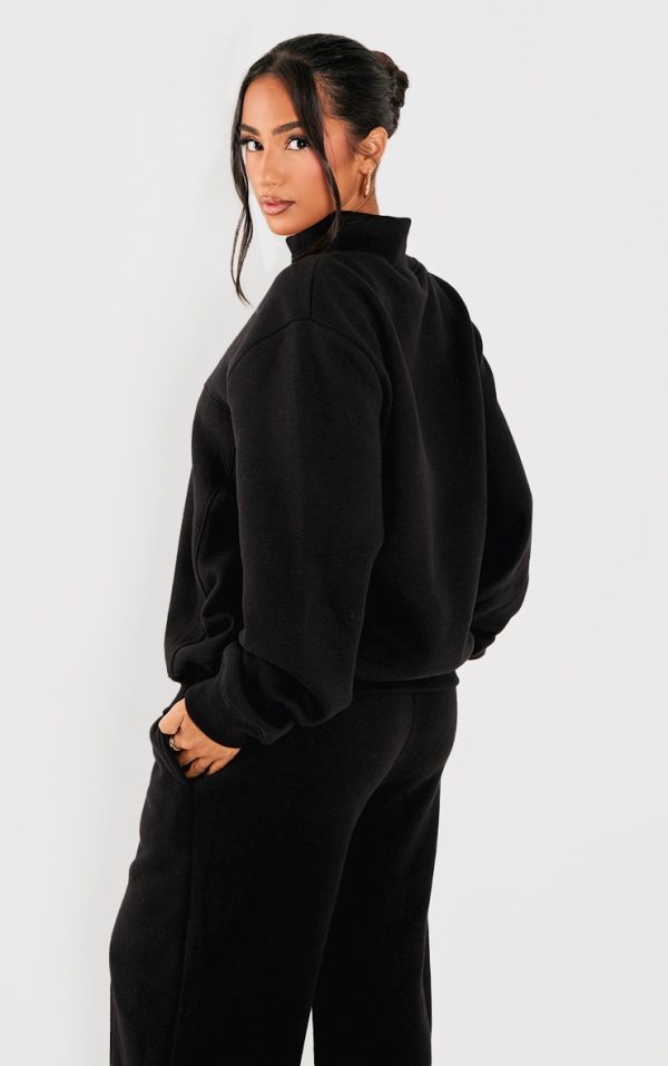 3e40b322bb3b56e32ecf37a326c60faaaeb619a0_CNK4386_2_petite_black_seam_detail_zip_through_track_top