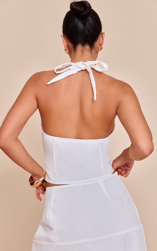 3eba4faa3a836c76525a5f576c9dd82a86785e91_CNM8779_2_white_woven_halterneck_button_detail_top