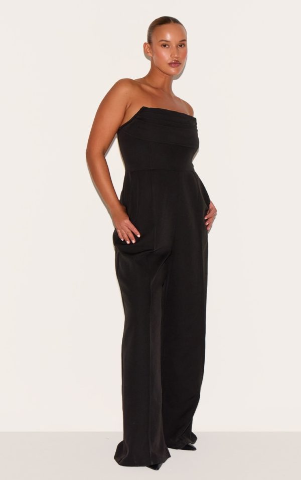 3fbf9ebbc5556decaef0914a741bac8d3d8fdac6_CNM0283_3_plus_black_bandeau_cowl_neck_pocket_detail_jumpsuit