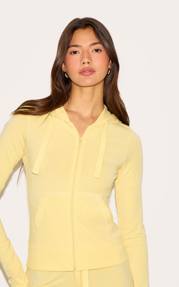 4256a0a61121734dfc1ec47ce090f0af2ed6ce57_CNN0641_4_butter_yellow_zip_up_fitted_track_top
