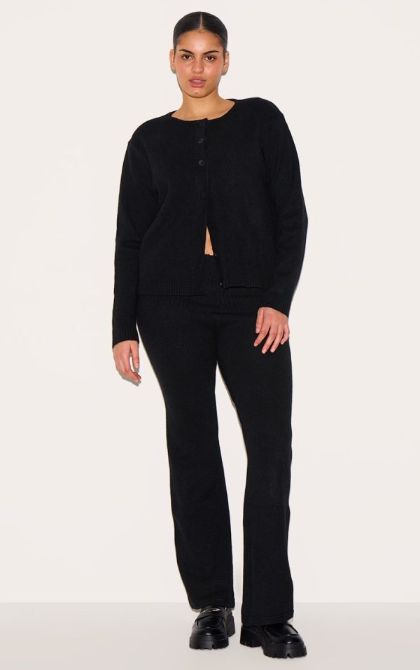 425997a26bb0a6f5adee60b1e175c1a9c790504c_CNJ1990_1_plus_black_melange_soft_knit_foldover_waist_flared_trousers