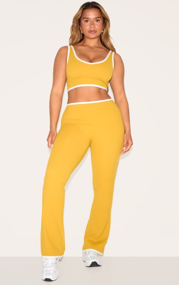 42e36674f395404bf249d89436b8a1af271c33aa_CNM6437_1_shape_olive_sculpt_active_contrast_binding_flare_trousers