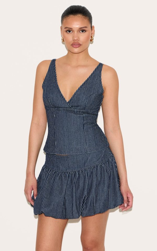 43dd8802ddb77da839a6b7a48d1aa363f5cb4a99_CNL7946_1_navy_pinstripe_denim_puffball_mini_skirt
