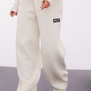 PRETTYLITTLETHING Petite Cream Badge Detail Straight Leg Joggers