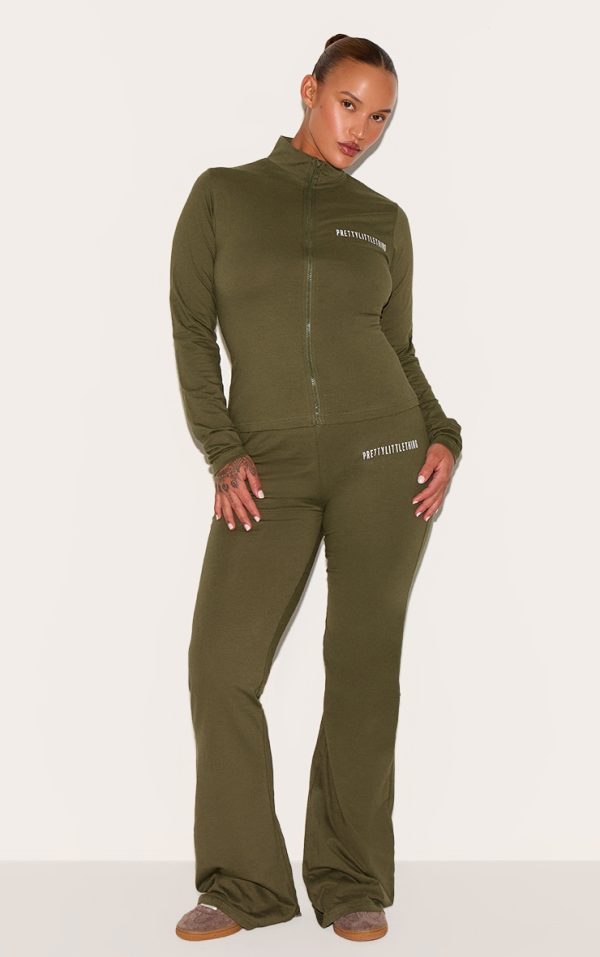 4dc7fe3afbbe4213372e02bc89093ac83bdf70af_CNH5589_1_prettylittlething_plus_khaki_jersey_skinny_flared_trousers