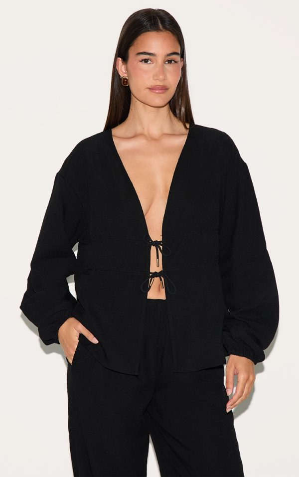 4e94b82530d80eeaa5d0b0dcac3a45474c9282ed_CNM2109_1_black_ruched_side_long_sleeve_plunge_top