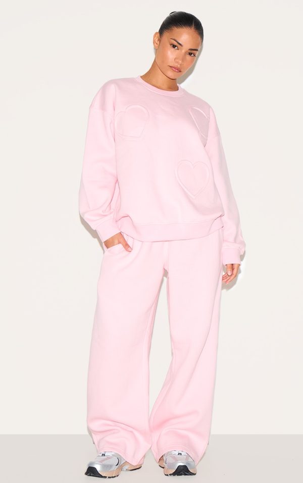 4ede174cad74d9b0a94c0c4f8fa5abd54f07ddfb_CNH8045_3_petite_pink_embossed_heart_detail_sweatshirt