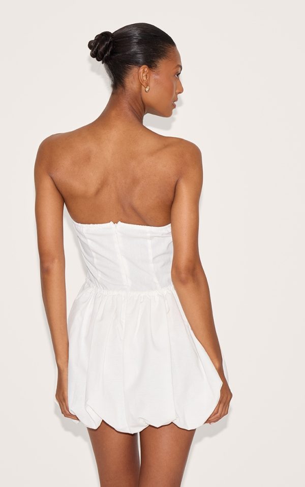 4ee135af26a59398c0658cea6d6c32974144710d_CNL8932_2_white_linen_bandeau_tie_waist_puffball_dress