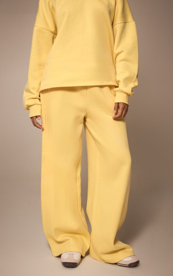 4f2bc7e3b0a8794760dd7af57d6b7140517efd87_CNM6508_2_butter_yellow_wide_leg_pleated_detail_joggers