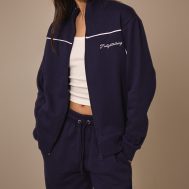 504de18e43287a0dc63f4446d00f7753d5823dfc_CNM4825_4_prettylittlething_dark_blue_contrast_piping_detail_zip_through_track_top
