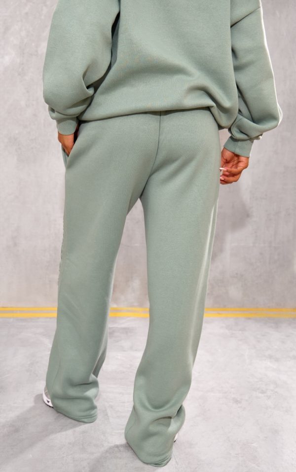 514222ed91479930b26ce5a12530137a6b2a4435_CNK1767_3_prettylittlething_sage_athletics_club_embossed_straight_leg_joggers