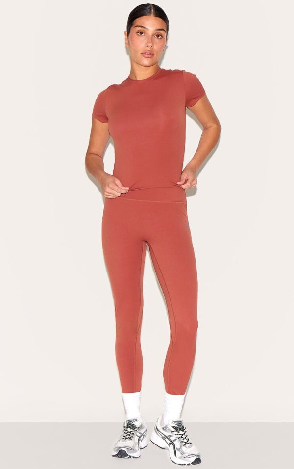 5189afdf01e2da3d52311fb1af026469fc6aba19_CNM4971_3_petite_paprika_sculpt_longline_gym_top_short_sleeve