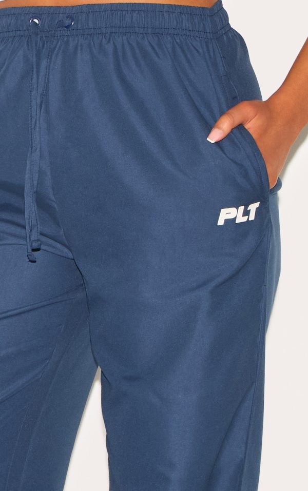 53e84a49d4571072546bec93f5721be521ff0ae5_CNL8298_4_prettylittlething_tall_navy_shell_drawstring_wide_leg_trousers