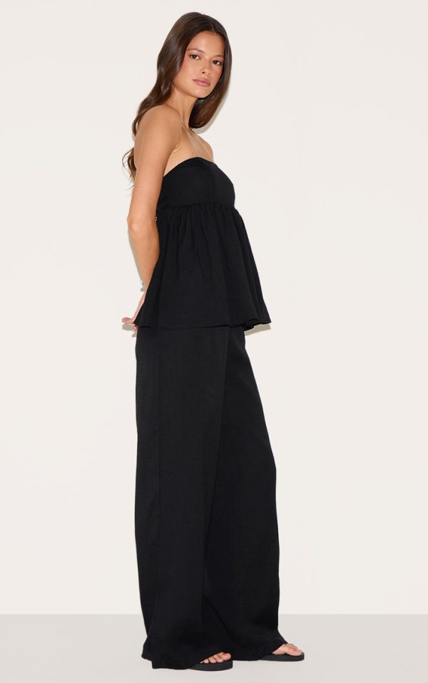 5470b763b4576bdad494d21af2bcf7959b2160b2_CNM0436_3_black_bandeau_peplum_detail_jumpsuit-1