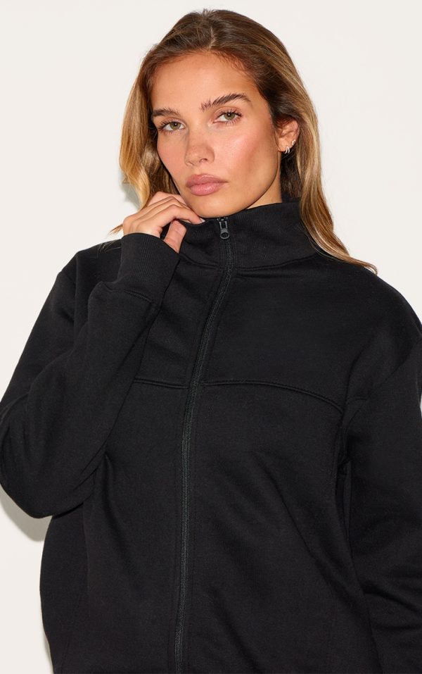 54ce09b8417147973d2a0f70db44f4b1840f5add_CNK9336_4_black_seamed_detail_zip_through_track_top