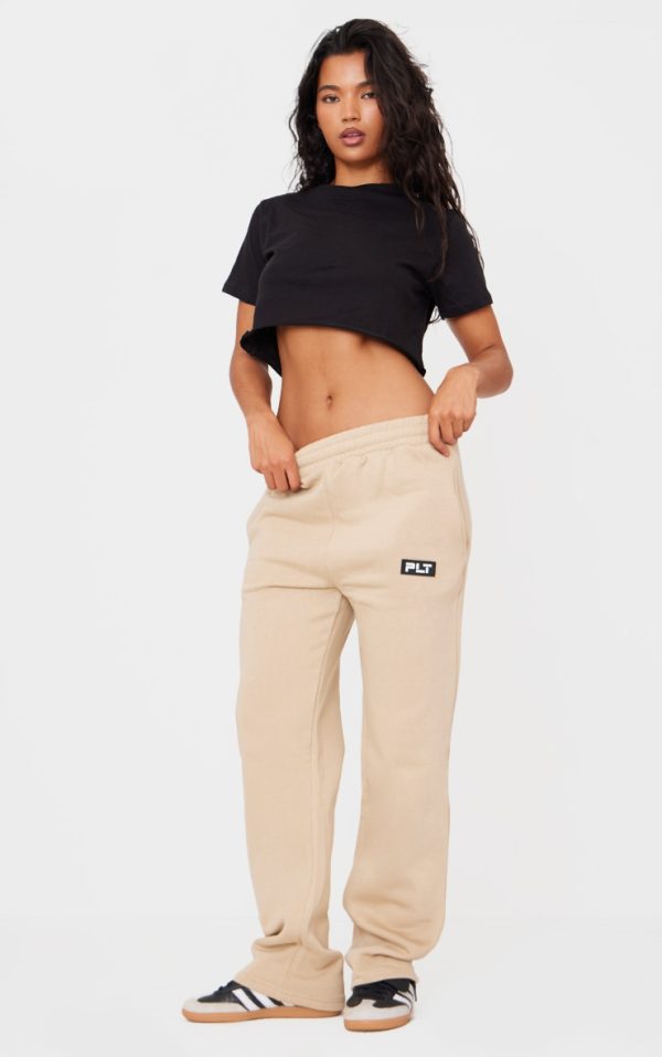 55525d3ce52240c54ccb94d558334c5b981b19f1_CNE5666_1_prettylittlething_sand_badge_detailed_straight_leg_joggers