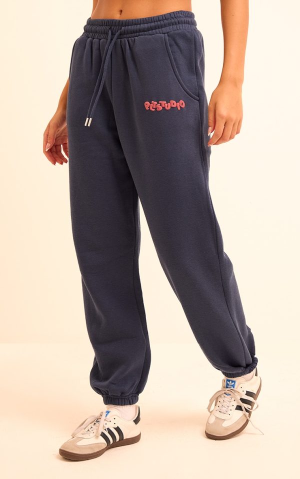 55f53f18383cba72d9415e92766d3537df11b76e_CNK0906_2_midnight_blue_plt_studio_archive_puff_print_drawstring_cuffed_joggers