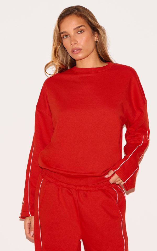 569060593c91745042d57492199adf874337b935_CNL8650_1_red_contrast_piping_detail_sweatshirt