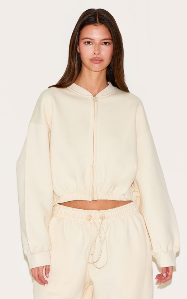56dc99a53ebf25a5ce7ed8ca40a9e49c106c06fc_CNM7125_1_cream_drawcord_waist_cropped_zip_up_sweatshirt