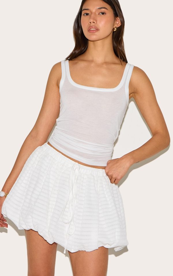 58c0e34a29d27f993b14c9c7bed9918d804ab589_CNM0509_1_white_textured_tie_waist_detail_puffball_mini_skirt