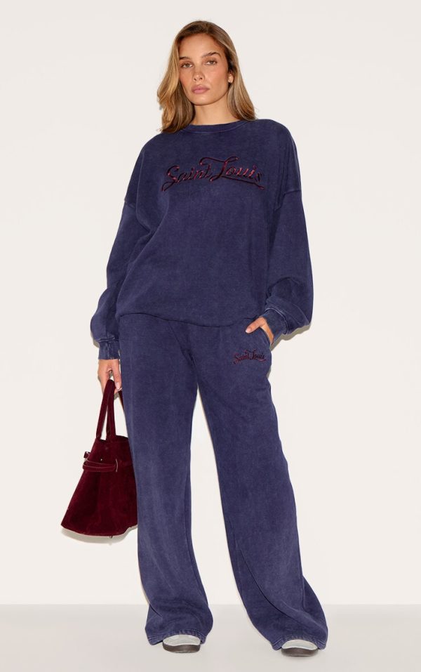 5a111858ba8533484583799a9a1f0001e776ac5f_CNM4687_1_navy_saint_louis_embroidered_wide_leg_joggers