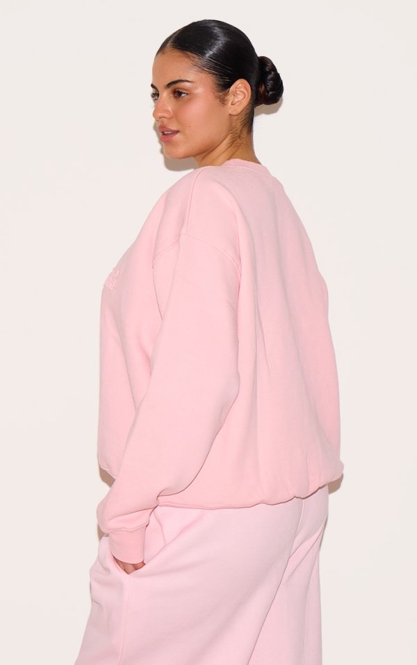 5a1d61b5b5c6889da5ef744563dc90fbc18ada26_CNK3401_2_plus_baby_pink_embossed_graphic_oversized_sweatshirt