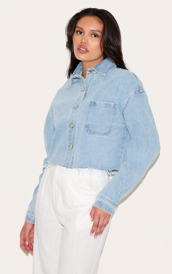 5b3c0b6e9384bb8933fd88d28f3b4c3c4dcbf7dd_CNL7793_1_light_blue_wash_raw_hem_cropped_denim_shirt
