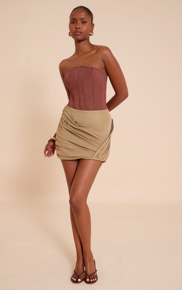 5e0b81223902483fda33aec466484c85abb67fe8_CNM7335_2_mushroom_woven_wrap_front_ruched_mini_skirt