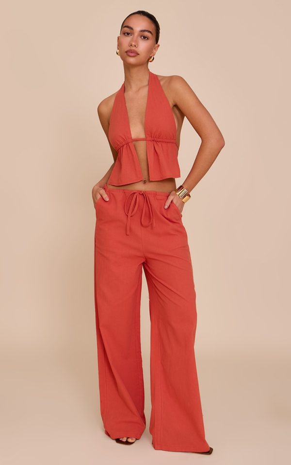 5e79841a7e53a3ef9c2dea9adbd818faad551491_CNM5228_1_rust_cotton_low_rise_drawstring_wide_leg_trousers