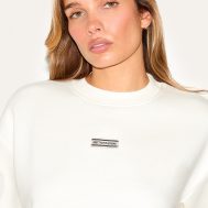 5e9dbf1ea13dba49ba57c7e4d83b46b7dc29b6da_CNI1468_4_prettylittlething_cream_badge_detail_oversized_short_sleeve_sweatshirt