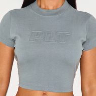 6023195f04992fe7b1cf2f07c933badbbfb23706_CNK0427_4_petite_teal_plt_embossed_cropped_baby_tee