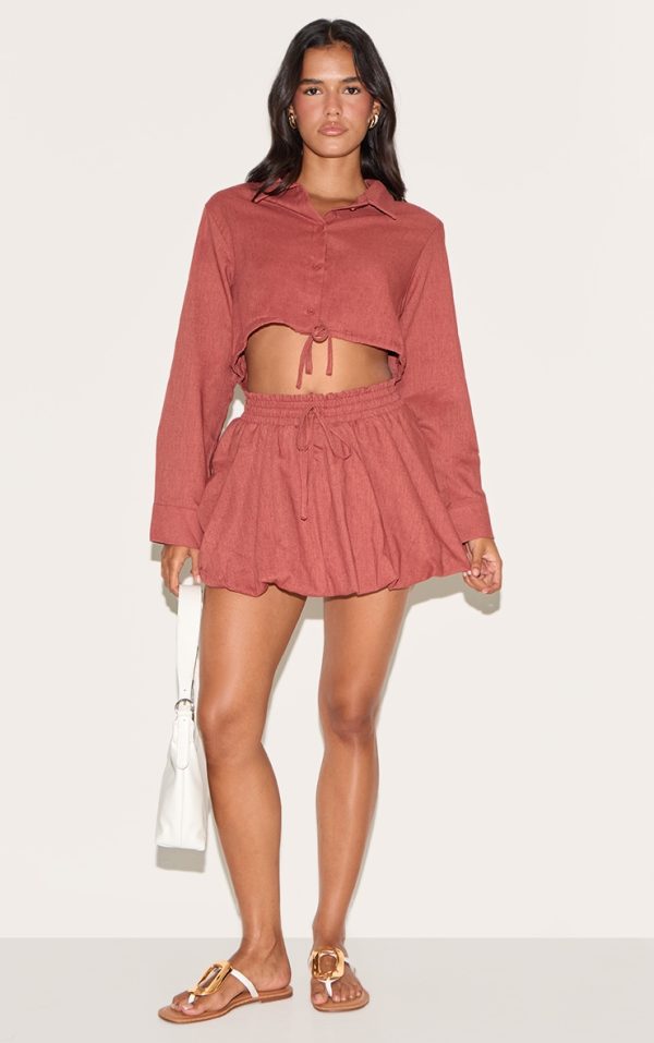 6065cf775bf2f3dcf50a77cfb9a2f44ccd0add72_CNM1731_4_rust_drawstring_puff_ball_skirt