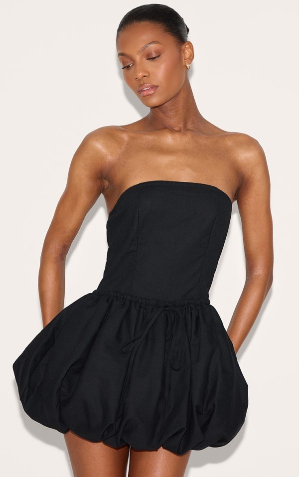 60dd8725c446f1ad3bc657b0b823fb35562ead92_CNL8933_1_black_linen_bandeau_tie_waist_puffball_dress-1