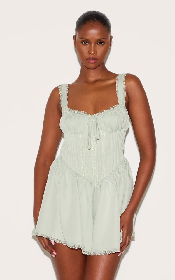 63067317ccae143d7ad1bea1ba132d54d21f31f8_CNM0010_1_sage_green_woven_lace_detail_strappy_playsuit-1