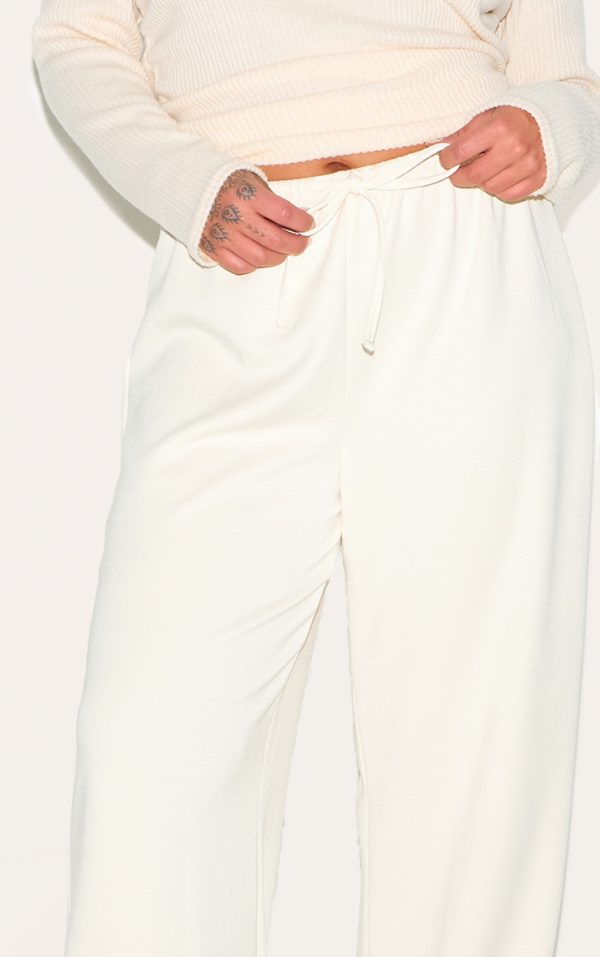 632b4488260ffb8b91c6d900371a078d48b3866f_CNM0278_4_plus_cream_premium_soft_touch_low_rise_drawstring_waist_straight_leg_trousers