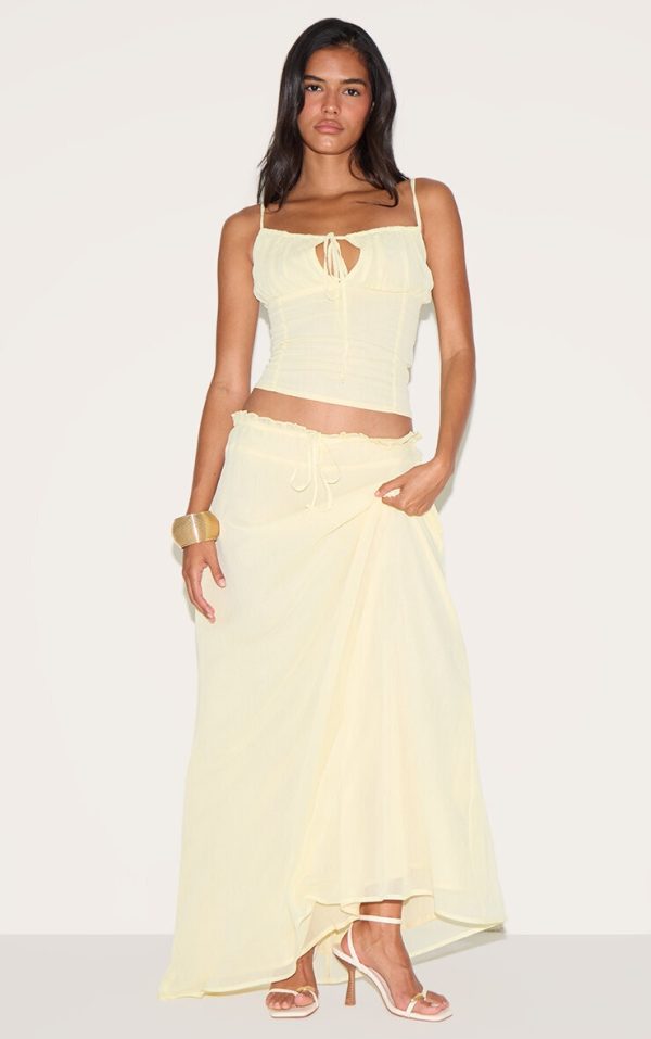 6be84397580a4423431bb40ac61a75fec4d69bf6_CNM3223_1_butter_yellow_chiffon_floaty_maxi_skirt