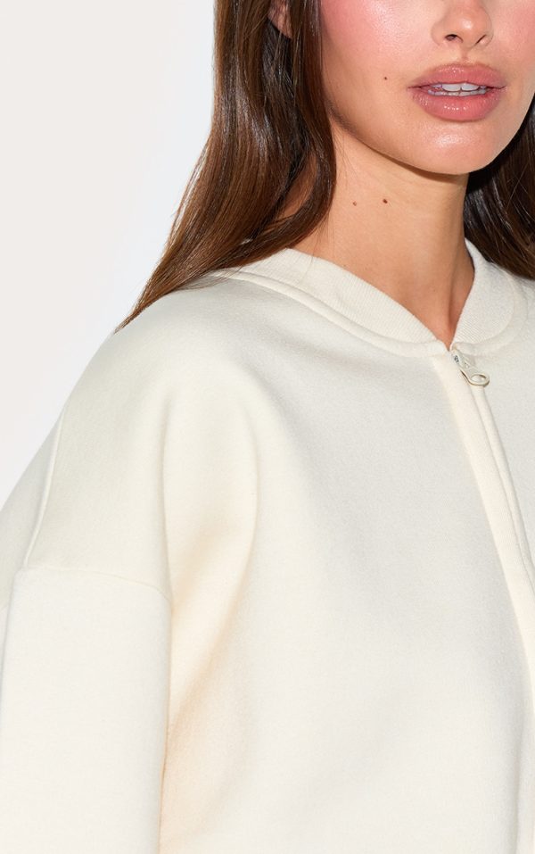 6c5cb58577fafd2d00b3f0da76ba455a3b00f730_CNM7125_4_cream_drawcord_waist_cropped_zip_up_sweatshirt