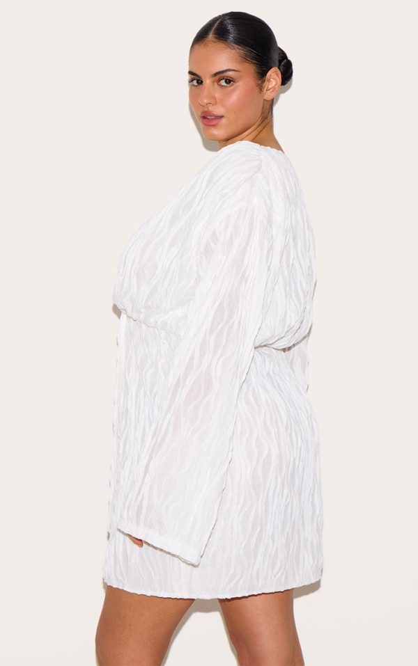6c9eaac79e2d7def4706f8e67d87676cfa696760_CMR0790_2_plus_white_textured_wrap_front_dress