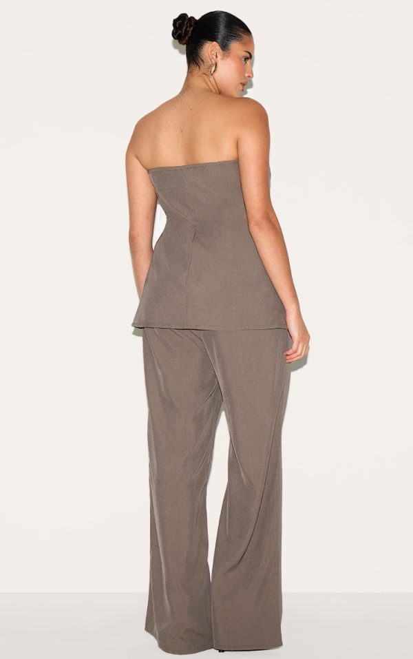 6d0ff32cf18f42417b87b13cf538826b55c9a0b9_CNM2025_2_plus_taupe_woven_tailored_longline_bandeau_flared_jumpsuit