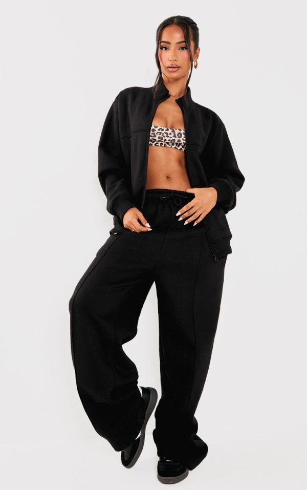 6d3970868bb71f72df578abe6cff21fe246cfc2f_CNK4386_3_petite_black_seam_detail_zip_through_track_top