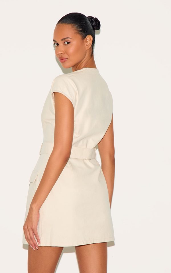 6ea11e220fe0e2e07c72502da5d7157824147dc3_CNM0574_2_almond_woven_utility_pocket_detail_mini_dress-1