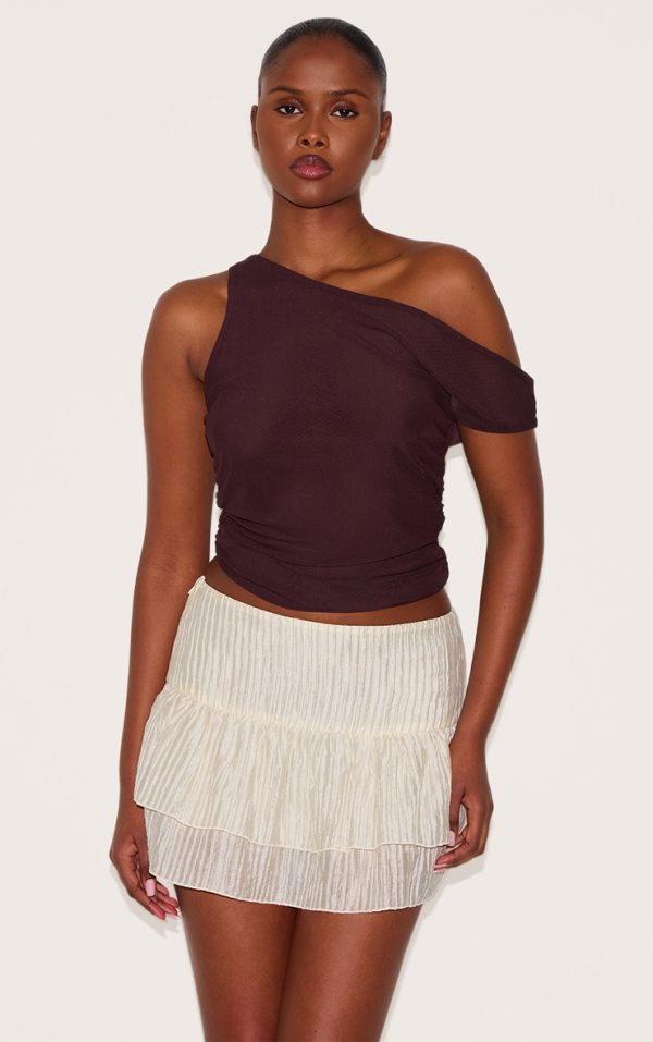 6f1025aebb8fc9212ea63b90ccb520089a75aaeb_CNL9322_4_almond_crinkle_woven_dropped_waist_frilly_mini_skirt
