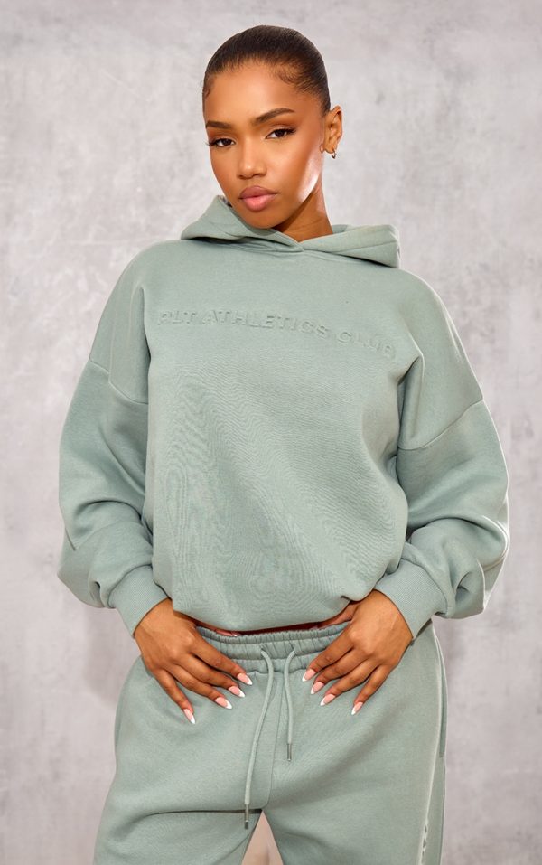6f70f6850b8452745bf798442513974c975d01d3_CNK1766_1_prettylittlething_sage_athletics_club_embossed_graphic_oversized_hoodie