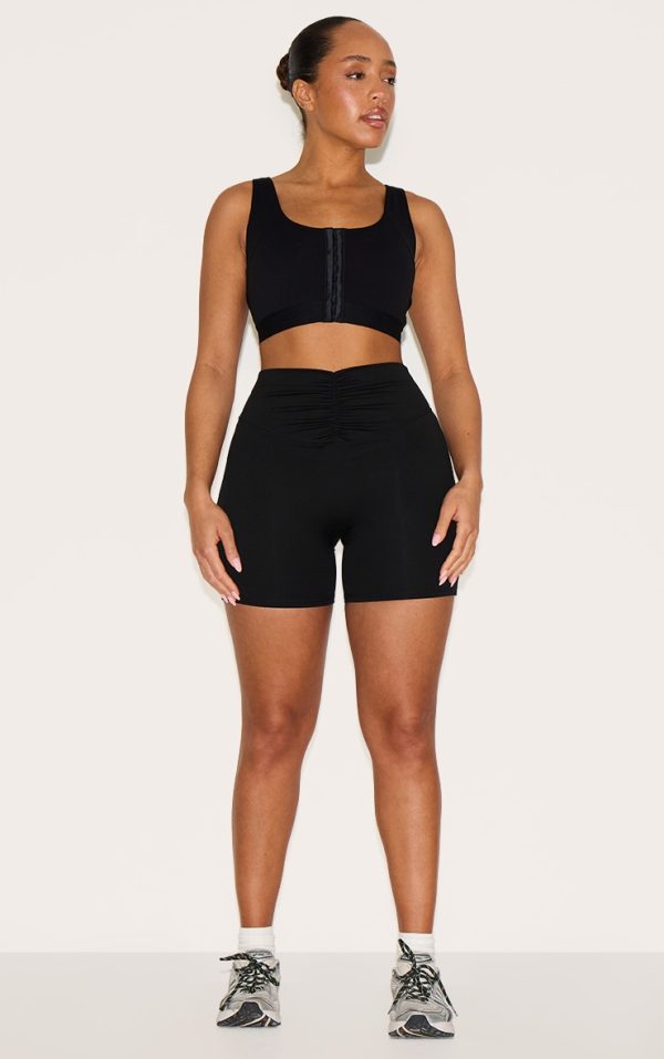 73179452b716a8d83d4ec9771c5ce2beb4625cbe_CNM2607_3_shape_black_active_hook_and_eye_front_support_strap_padded_sports_bra