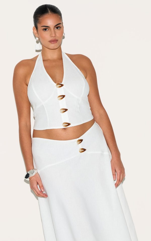 7754bed4915ddd47af339a82a0f31f1629f7d24d_CNN0786_1_plus_white_woven_halterneck_button_detail_top