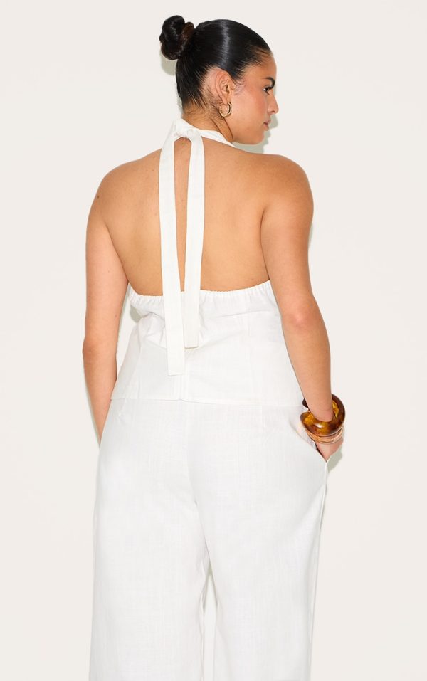 7843a2e9a2c45c16fc3a499b91004b041fb6eeba_CNM6532_2_plus_white_linen_twist_front_halter_neck_top
