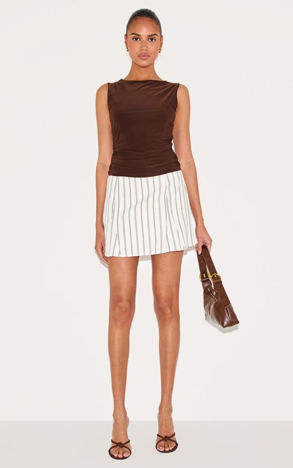 78700a8f9a3c3272178713441f0a8786d355ff98_CNL9073_1_cream_pinstripe_peach_skin_flippy_mini_skirt-1