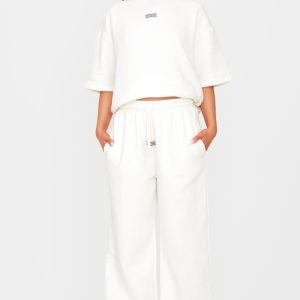 PRETTYLITTLETHING Cream Badge Detail Mid Rise Wide Leg Joggers