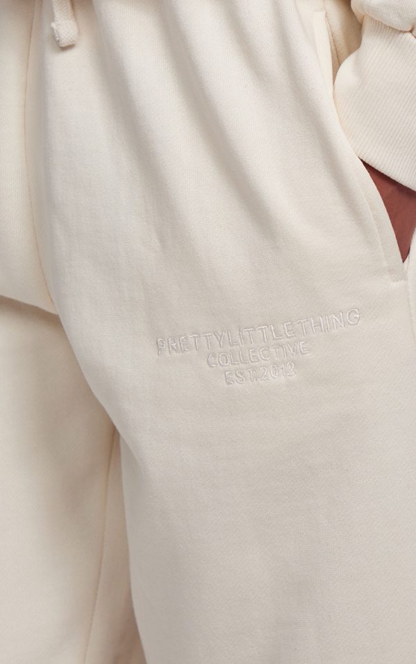 790d0d149bd8e6e6cb96acf17d5d66c9c1599be2_CNK1749_4_prettylittlething_cream_premium_embroidered_oversized_wide_leg_joggers